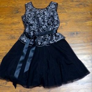 Beautiful NWT black dress zips up the back